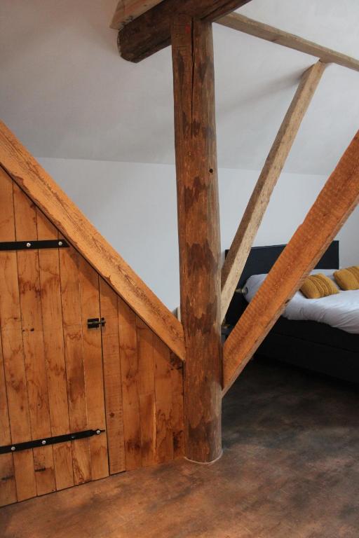 Postel nebo postele na pokoji v ubytování B&B de Sfeerhoeve