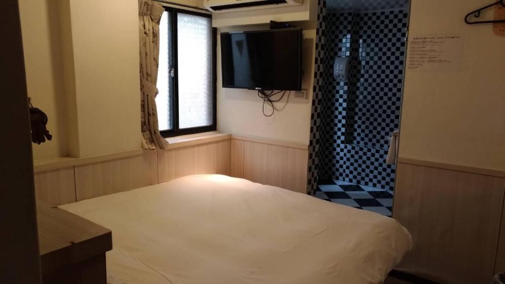 Postel nebo postele na pokoji v ubytování Galaxy Mini Inn