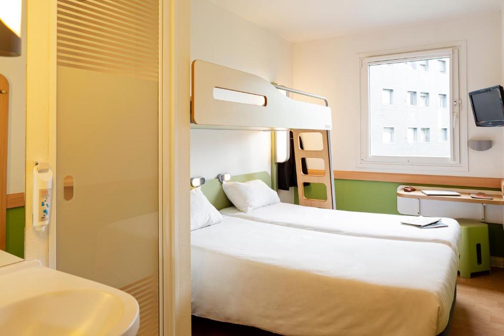 Postel nebo postele na pokoji v ubytování Ibis Budget Oviedo