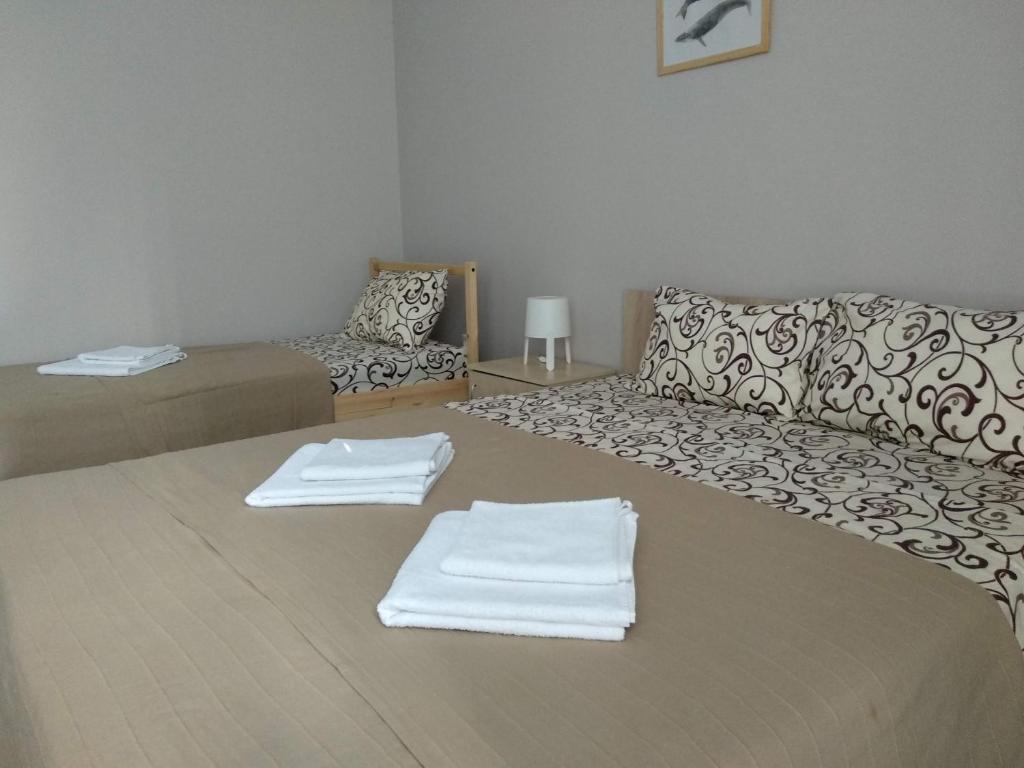 Postel nebo postele na pokoji v ubytování Apartments na Beregu