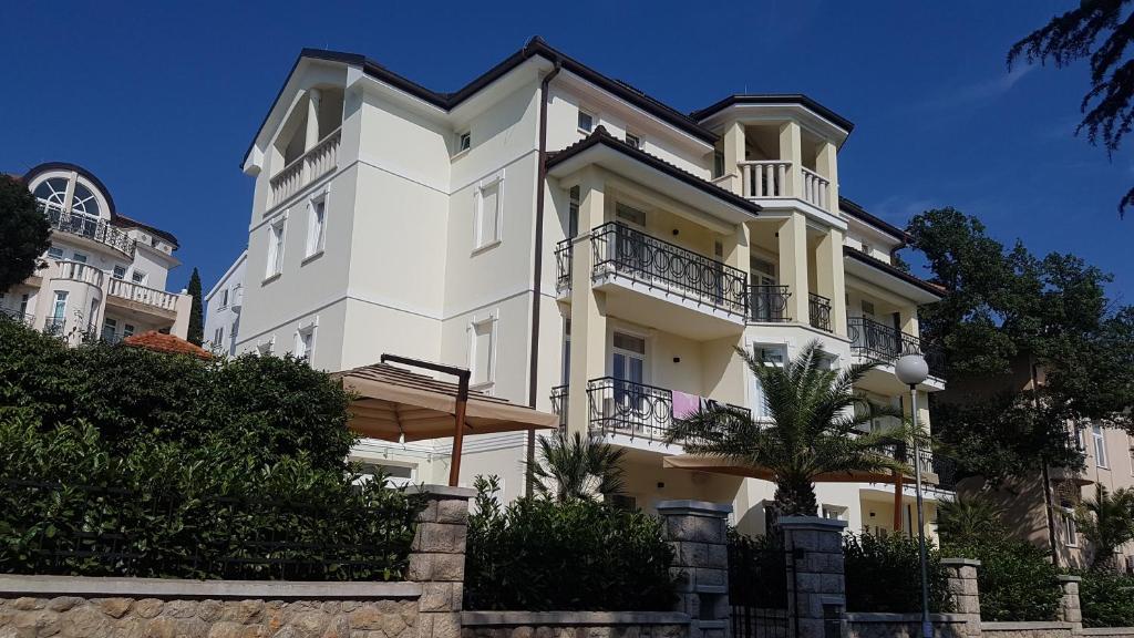 a large white building with balconies on it at Villa Emilia in Crikvenica
