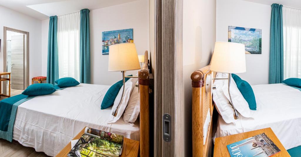 Postel nebo postele na pokoji v ubytování Hotel Capitol