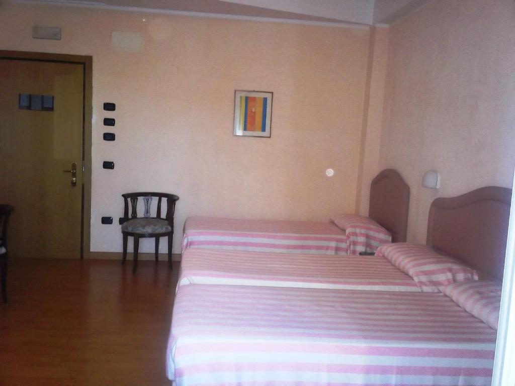 Postel nebo postele na pokoji v ubytování Hotel Gaggiano