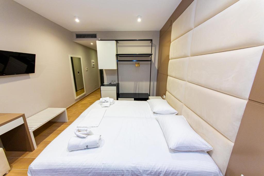 Postel nebo postele na pokoji v ubytování Delight Hotel