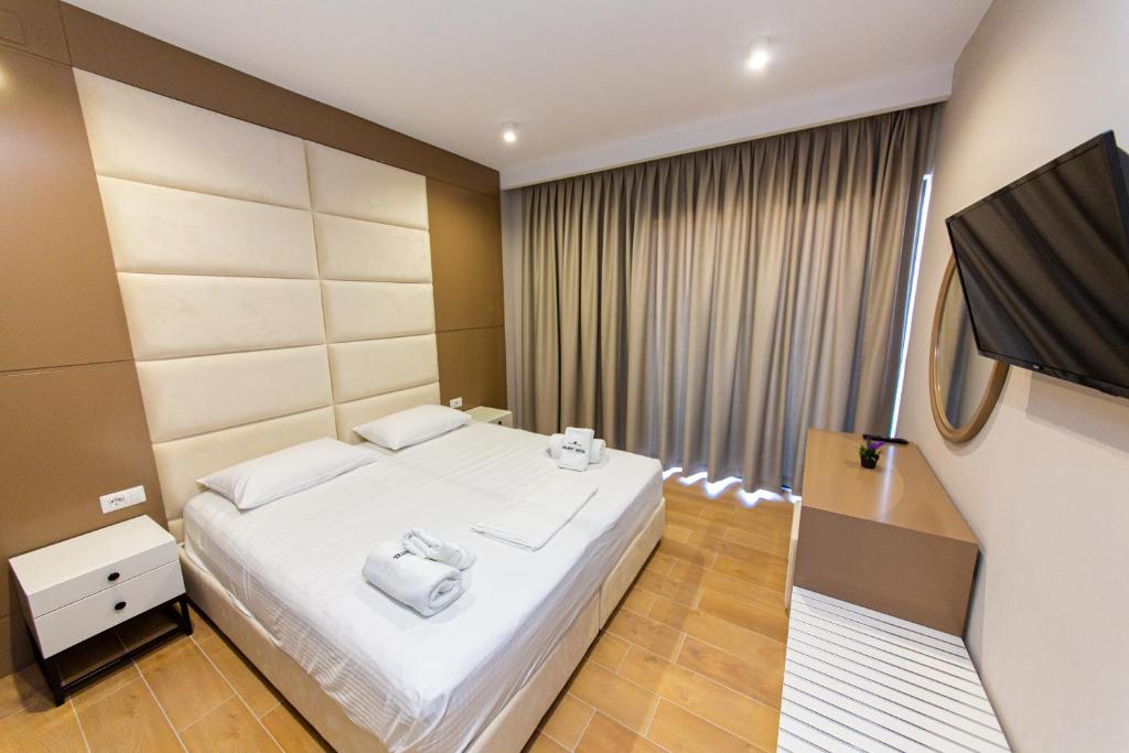 Postel nebo postele na pokoji v ubytování Delight Hotel