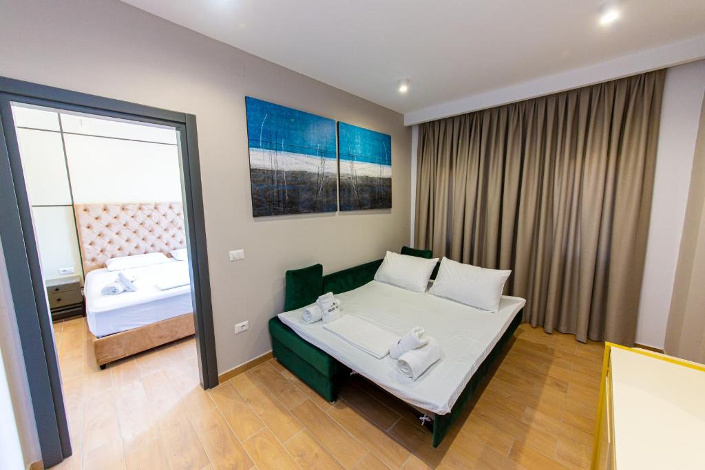 Postel nebo postele na pokoji v ubytování Delight Hotel