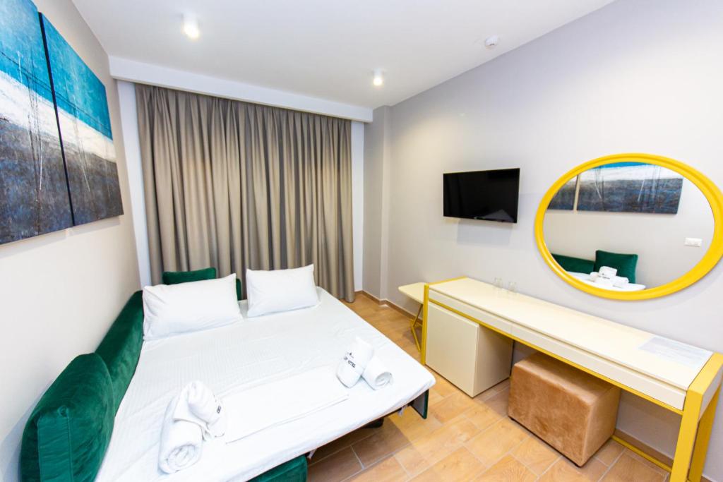 Postel nebo postele na pokoji v ubytování Delight Hotel