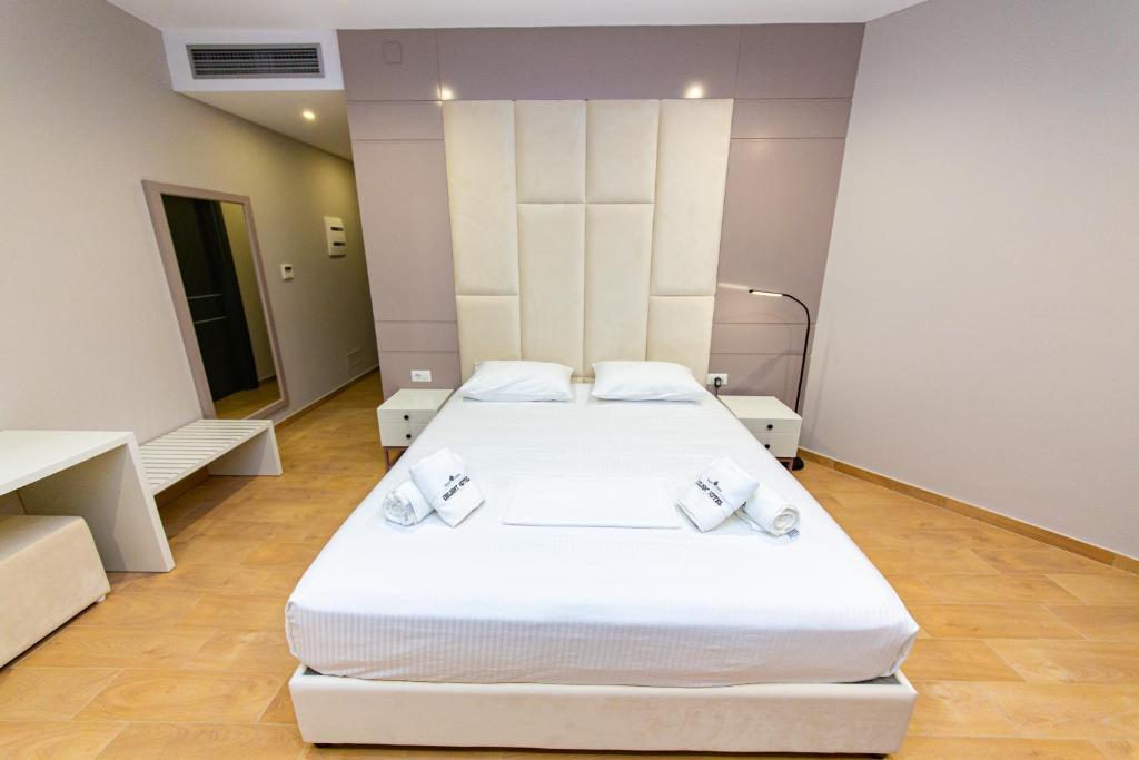 Postel nebo postele na pokoji v ubytování Delight Hotel