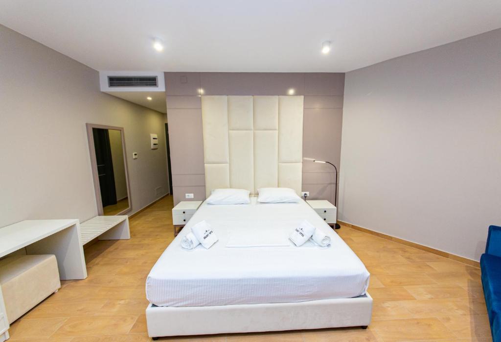 Postel nebo postele na pokoji v ubytování Delight Hotel