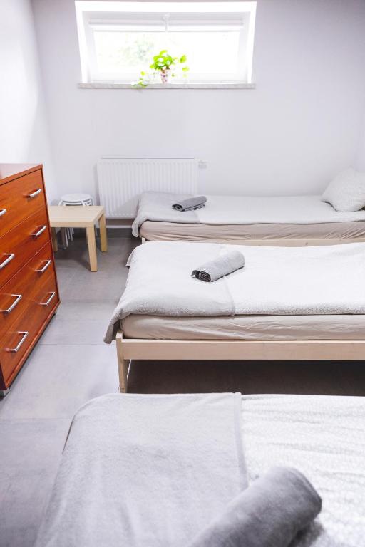Postel nebo postele na pokoji v ubytování Hostel 55 - darmowy parking