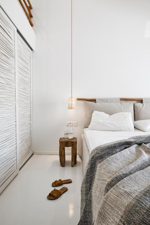 Łóżko lub łóżka w pokoju w obiekcie Arco Solium Suites