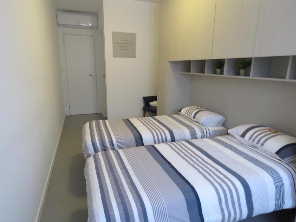 Postel nebo postele na pokoji v ubytování Assago Forum Apartment
