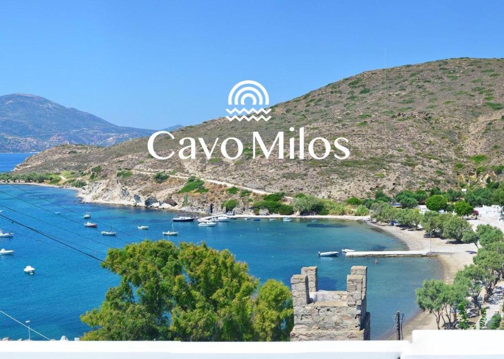 a view of a bay with boats in the water at Cavo Milos in Adamantas