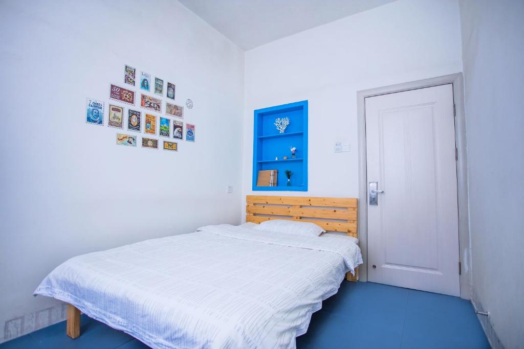 Postel nebo postele na pokoji v ubytování Murphy Youth Hostel Guilin桂林北站莫非青年旅舍