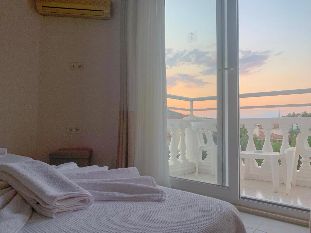 Postel nebo postele na pokoji v ubytování Kaizen Gate Hotel