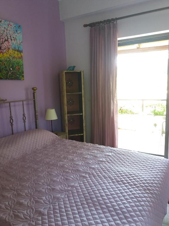 Postel nebo postele na pokoji v ubytování Alexandra Spingou Apartments