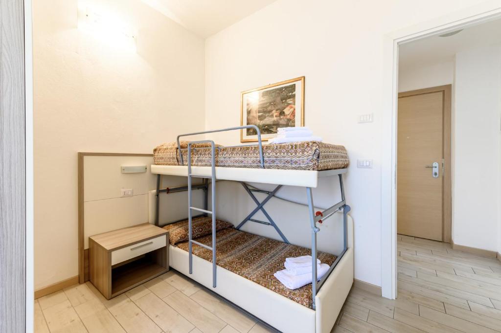 a bedroom with bunk beds in a room at Hotel St Gregory Park in Rimini