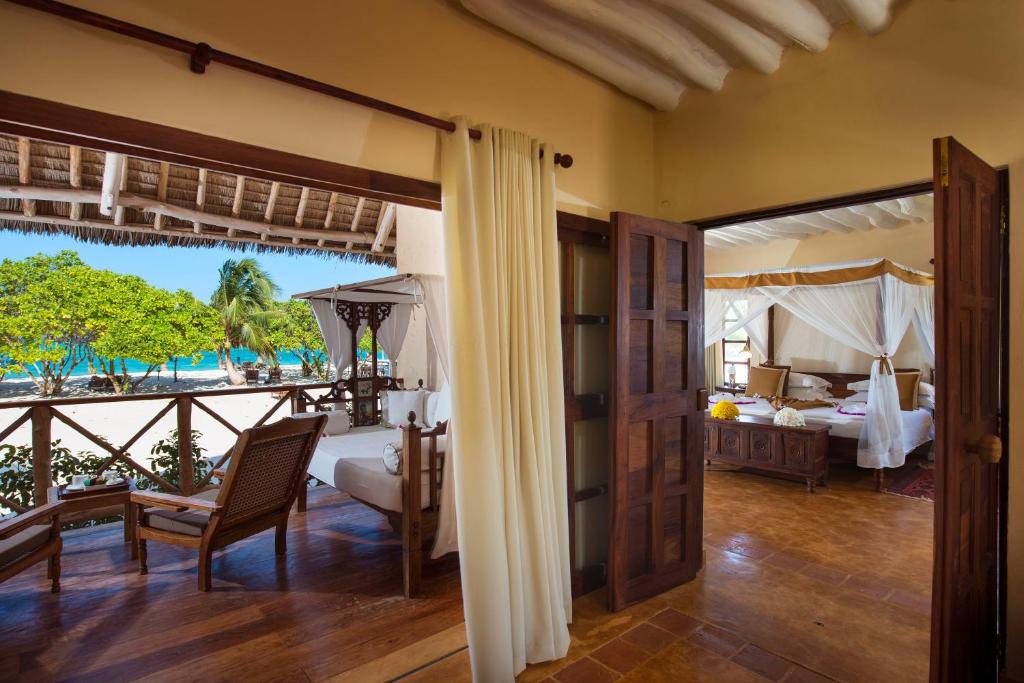 Postel nebo postele na pokoji v ubytování Neptune Pwani Beach Resort & Spa Zanzibar - All Inclusive