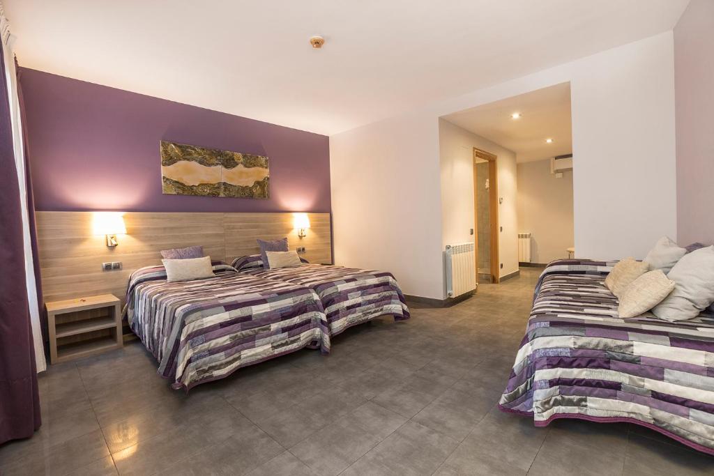 Postel nebo postele na pokoji v ubytování Hotel Victor