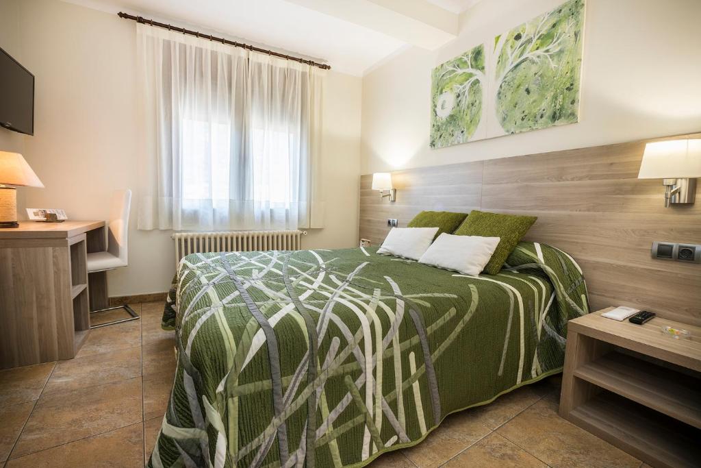 Postel nebo postele na pokoji v ubytování Hotel Victor