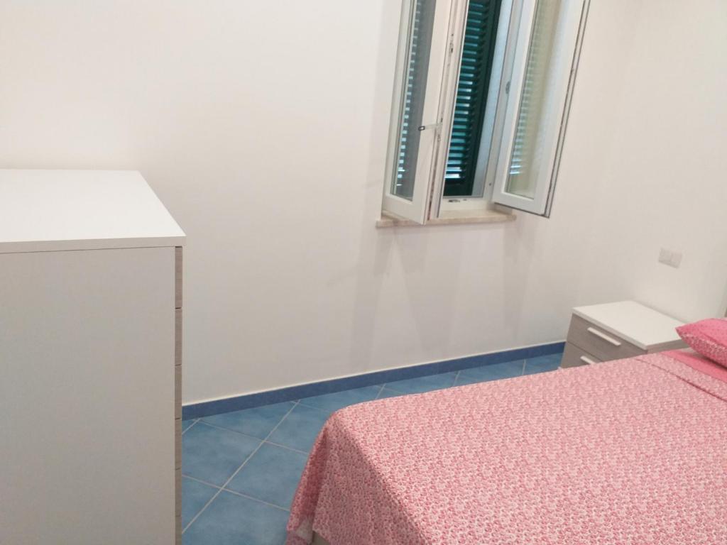 Postel nebo postele na pokoji v ubytování Appartamento g. Cervera66