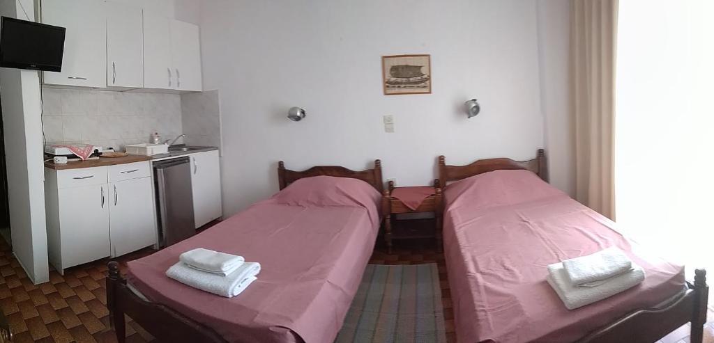 Postel nebo postele na pokoji v ubytování Bissias Guest House