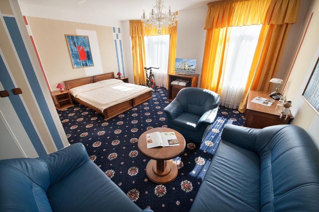Postel nebo postele na pokoji v ubytování Brioni Suites