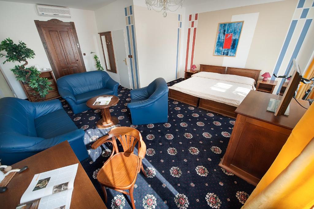 Postel nebo postele na pokoji v ubytování Brioni Suites
