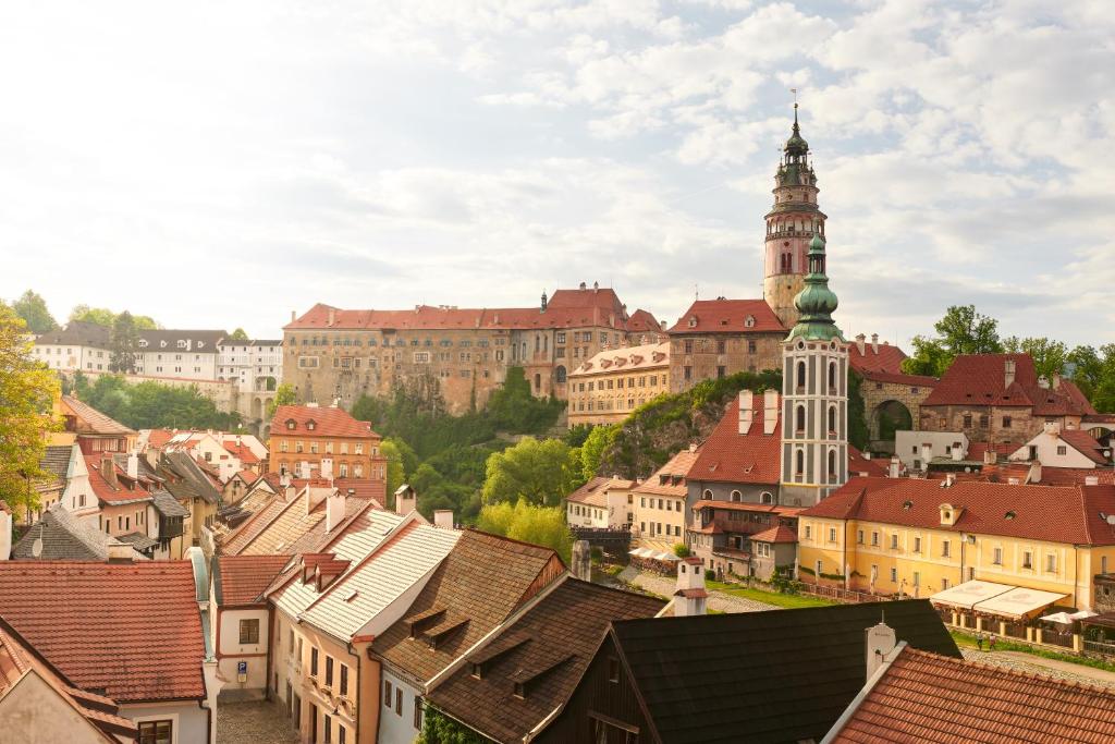 a view of a city with a clock tower at Pension Kristian by KH in Český Krumlov