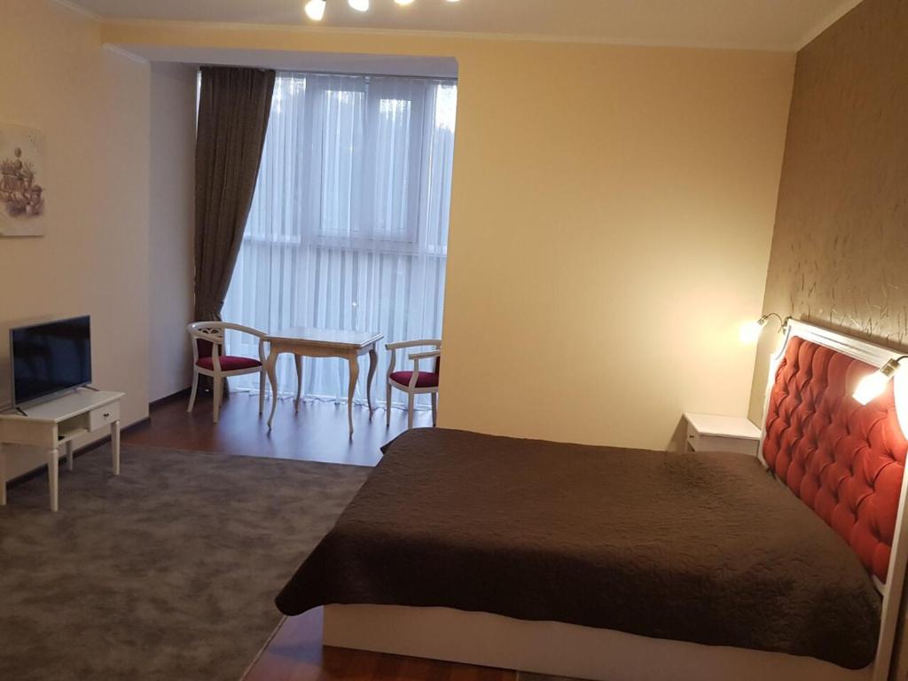 TV a/nebo společenská místnost v ubytování Helen Hotel