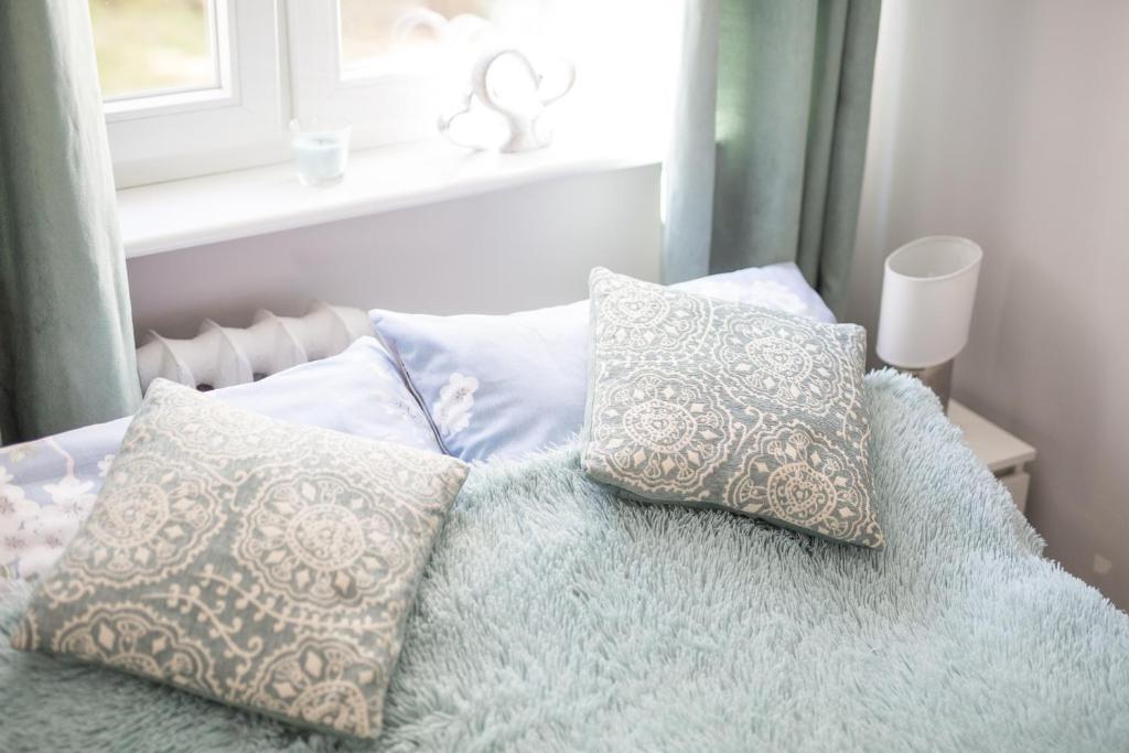 Posteľ alebo postele v izbe v ubytovaní Apartament uJasia