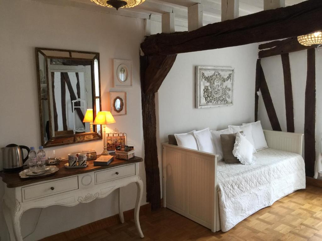 Postel nebo postele na pokoji v ubytování B&B les Agapanthes