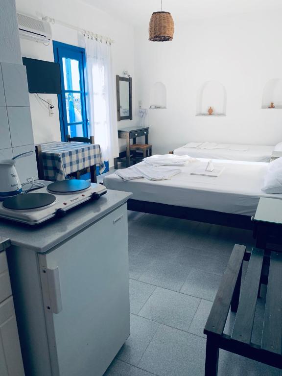 Posteľ alebo postele v izbe v ubytovaní Pelagos Studios