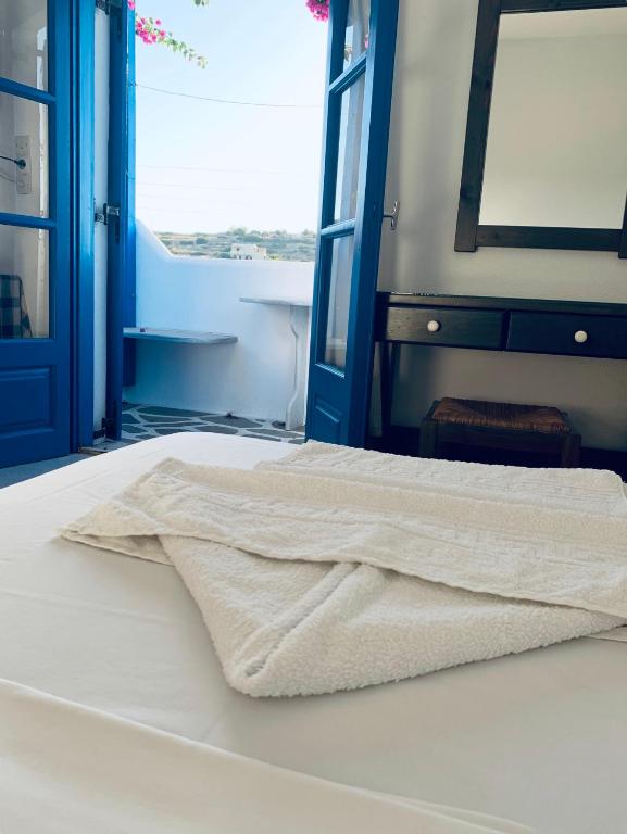 Posteľ alebo postele v izbe v ubytovaní Pelagos Studios