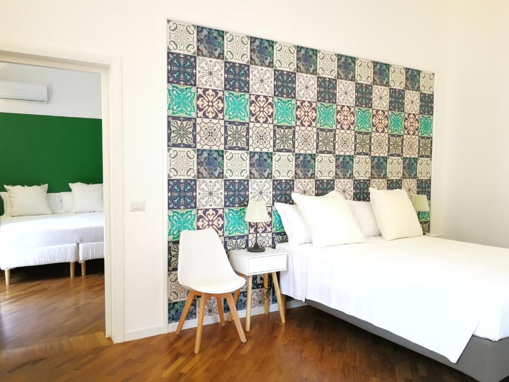 Voodi või voodid majutusasutuse Carulli 69 - Check-in Express apartments toas