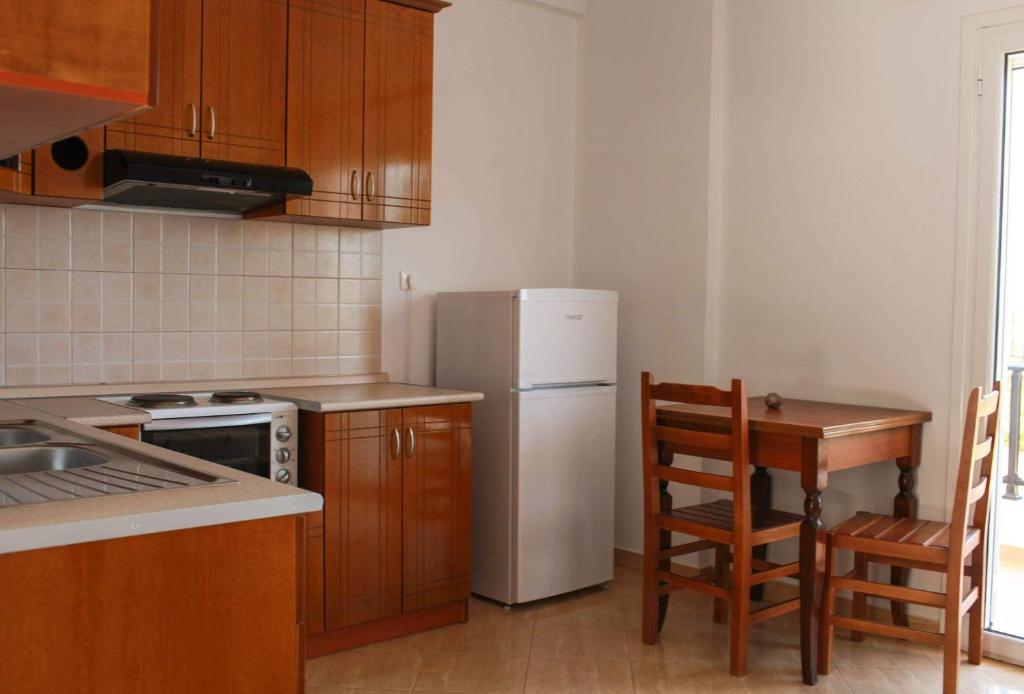 Kuchyň nebo kuchyňský kout v ubytování Mihalis Apartments