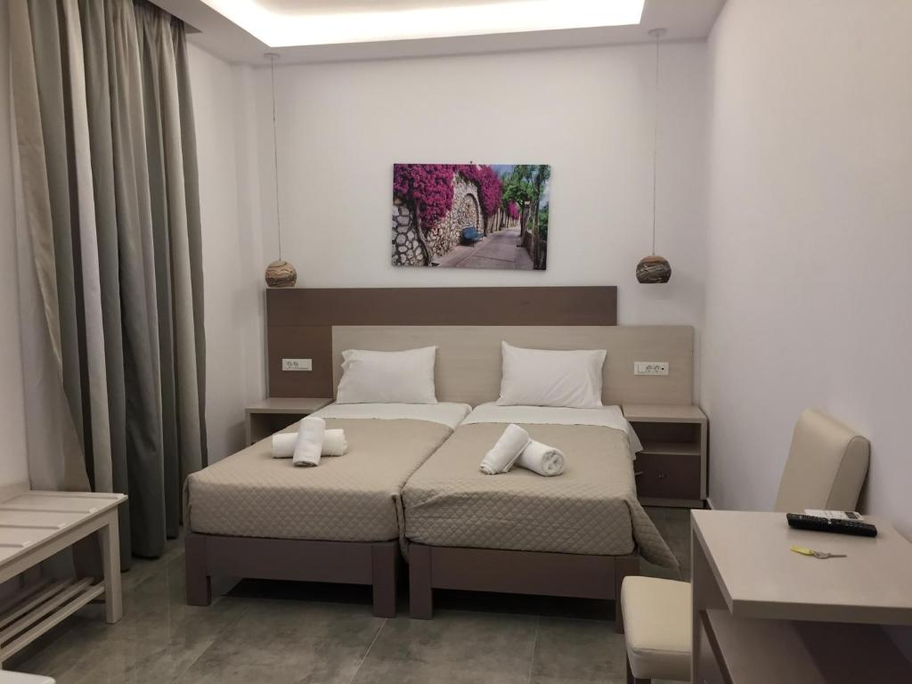 Postel nebo postele na pokoji v ubytování Diogenis Village Mykonos