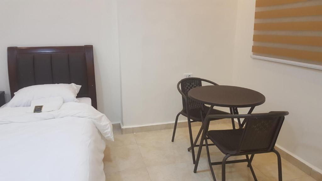 Postel nebo postele na pokoji v ubytování Sultan Home