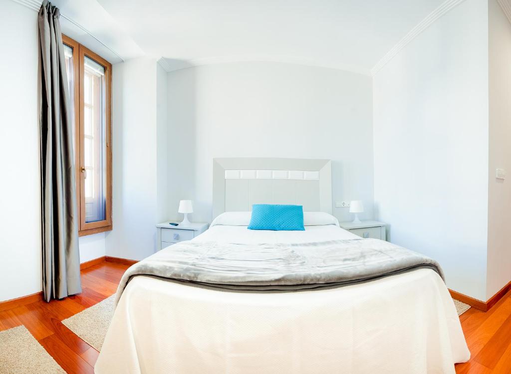 Posteľ alebo postele v izbe v ubytovaní Apartamentos Villa Zoila Baiona