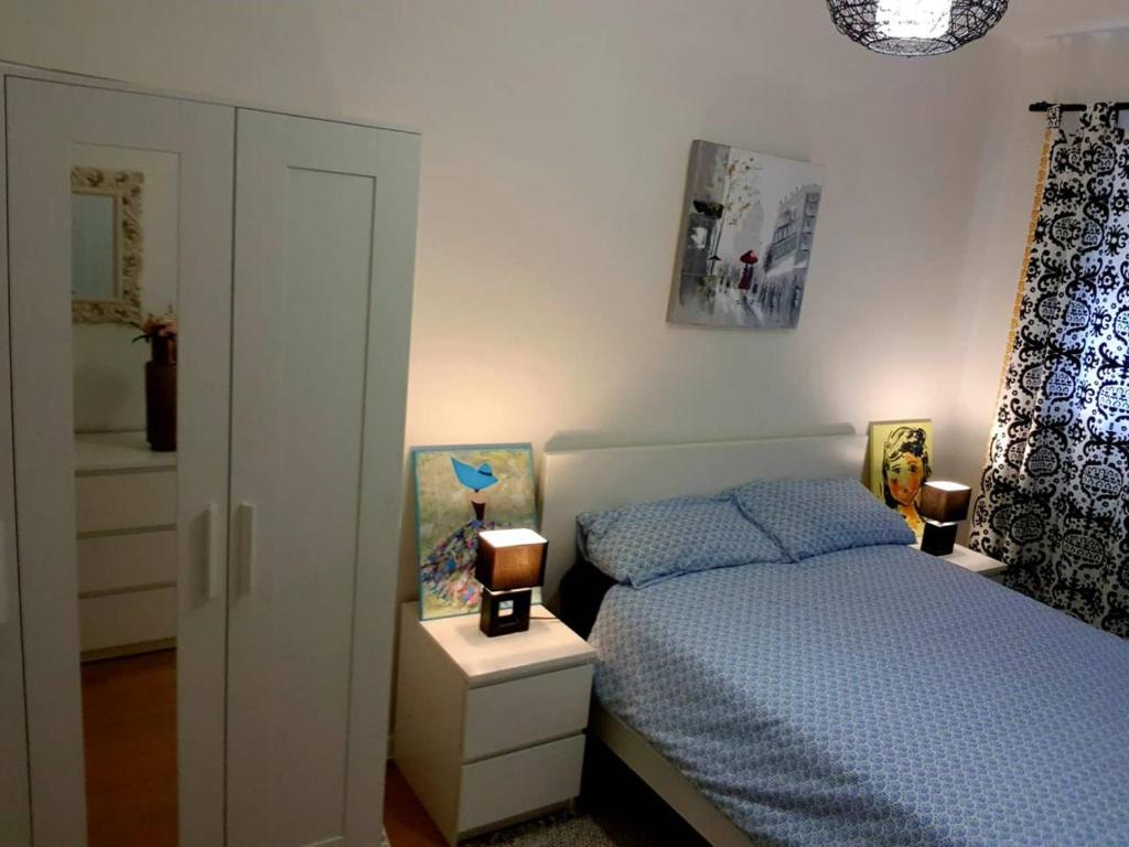 A bed or beds in a room at Casa Coqueta y confortable en Oviedo