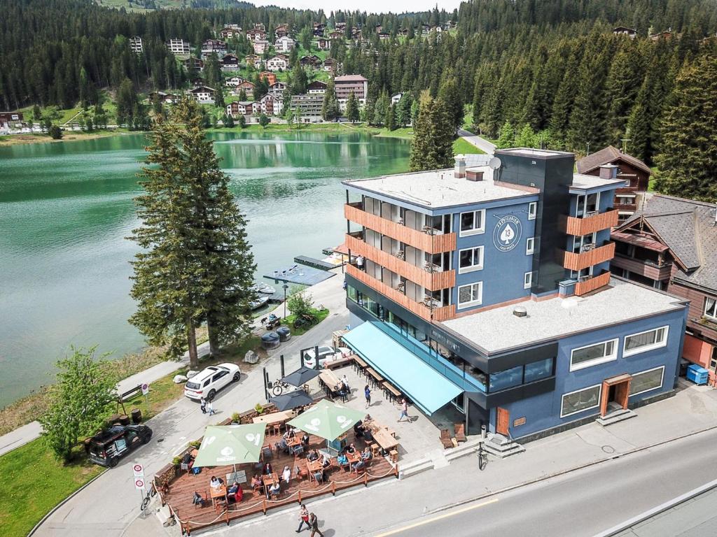 an aerial view of a hotel on the shore of a river at Hotel Provisorium13 in Arosa