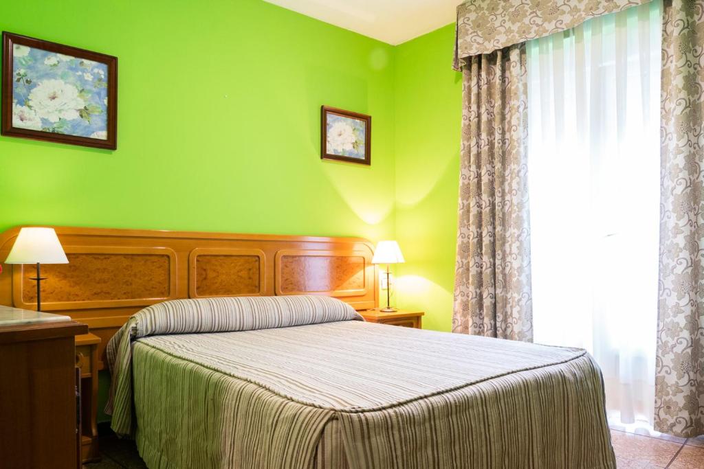 Cama o camas de una habitación en Alojamiento Calzada Romana
