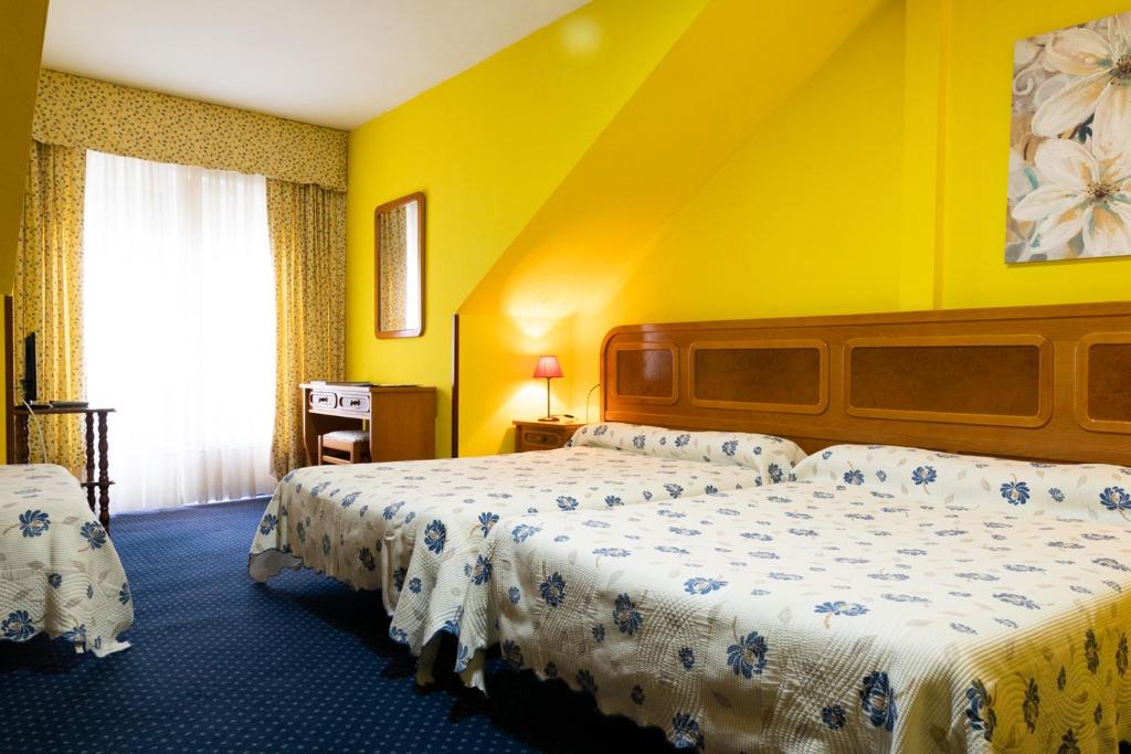 Cama o camas de una habitación en Alojamiento Calzada Romana