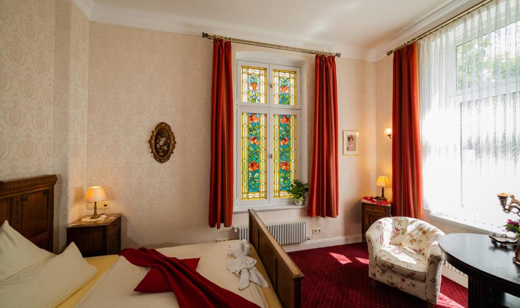 Postel nebo postele na pokoji v ubytování Hotel Seeufer