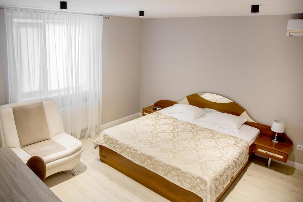 Postel nebo postele na pokoji v ubytování VIP Hotel