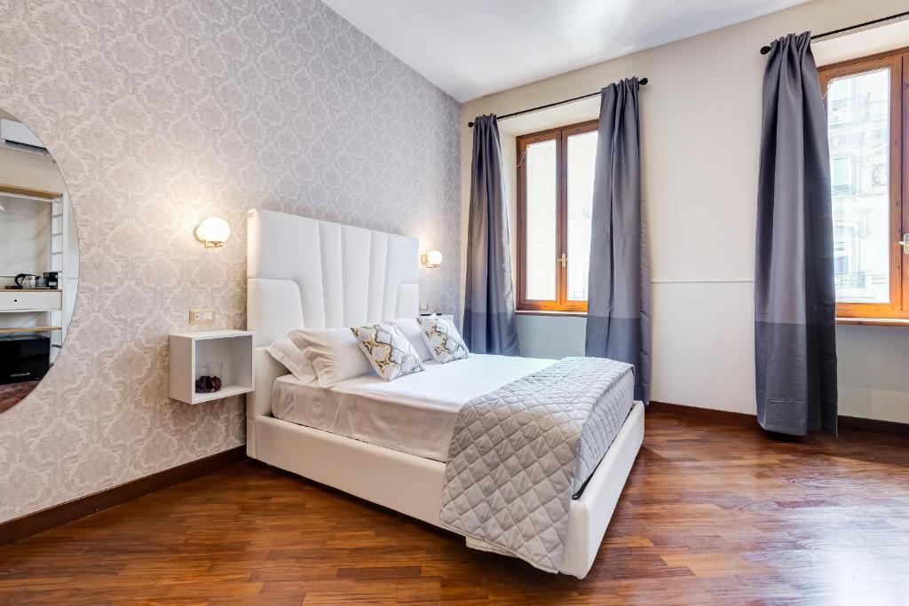 Ένα ή περισσότερα κρεβάτια σε δωμάτιο στο Trevi Private Suites by Premium Suites Collection
