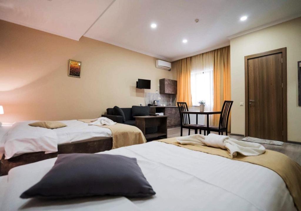 Postel nebo postele na pokoji v ubytování Hotel Nabadi
