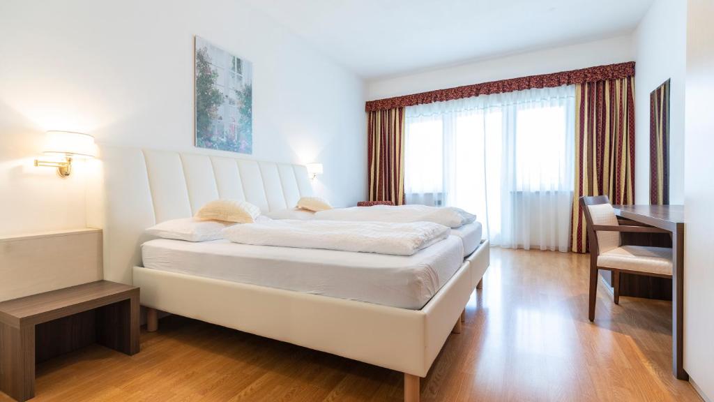 Postel nebo postele na pokoji v ubytování Hotel Markushof - Adults only