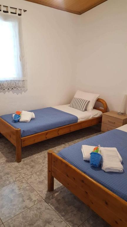 Postel nebo postele na pokoji v ubytování Villa Glaykos