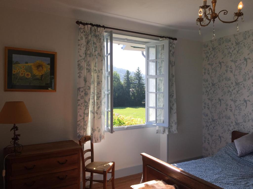Postel nebo postele na pokoji v ubytování Saint Sever des Pyrenees